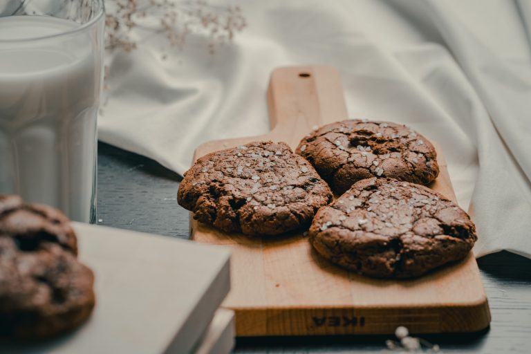 chocolate cookies on brown wooden chopping board